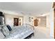 Spacious bedroom with ceiling fan, carpet flooring, and attached bath at 3393 Talley Ridge Dr, The Villages, FL 32162