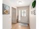 Inviting entryway featuring a decorative wreath and modern decor at 3393 Talley Ridge Dr, The Villages, FL 32162