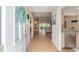 A glimpse into a charming home, highlighting the welcoming foyer, dining area, and modern kitchen at 3393 Talley Ridge Dr, The Villages, FL 32162