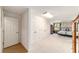 Hallway with large closets leading to bedroom with carpet, large window and a ceiling fan at 3393 Talley Ridge Dr, The Villages, FL 32162