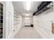 Spacious walk-in closet with wire shelving, carpet flooring, and a small window at 3393 Talley Ridge Dr, The Villages, FL 32162