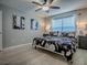 Cozy bedroom with stylish decor featuring a ceiling fan, decorative lighting, and luxury vinyl plank flooring at 3432 Fairfield St, The Villages, FL 32162