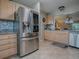 Spacious kitchen features stainless steel appliances, ample cabinetry, and a granite countertop at 3432 Fairfield St, The Villages, FL 32162