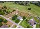 Scenic aerial view of a home and its proximity to the golf course at 36455 Clara St, Eustis, FL 32736