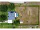 This is an aerial view of the home, showcasing its pool and well-maintained fenced in yard at 36455 Clara St, Eustis, FL 32736