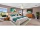 Staged primary bedroom featuring king bed, stylish decor, and a backyard view at 36455 Clara St, Eustis, FL 32736