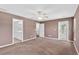 Spacious primary bedroom with large windows and ensuite bathroom access at 36455 Clara St, Eustis, FL 32736