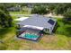 This home features a screened-in pool, solar panels, and a well-maintained backyard at 36455 Clara St, Eustis, FL 32736
