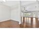 Bright open concept with rich hardwood floors, fan, recessed lights and view of the backyard and pool at 36455 Clara St, Eustis, FL 32736