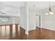 Bright living room with hardwood floors, natural light, and an open doorway to the backyard and pool at 36455 Clara St, Eustis, FL 32736
