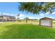Exterior showcasing the large backyard, outbuilding and screened pool at 36455 Clara St, Eustis, FL 32736