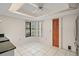 Bright kitchen nook features white tile flooring and a window overlooking the front yard at 36482 Doral Dr, Grand Island, FL 32735