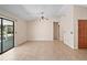 The living room is spacious with access to the hallway, closet and screened-in back patio at 36482 Doral Dr, Grand Island, FL 32735