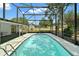 Relaxing screened pool area, seamlessly blending indoor and outdoor living for year-round enjoyment at 36482 Doral Dr, Grand Island, FL 32735