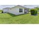 Backyard with patio and manicured lawn at 3745 Causey Ct, The Villages, FL 32163