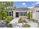 Welcoming front entrance with a modern door, manicured landscaping, and a stone walkway at 3745 Causey Ct, The Villages, FL 32163