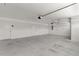 Spacious two-car garage with white walls and doors and concrete floors at 3745 Causey Ct, The Villages, FL 32163