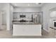 Well-lit kitchen featuring stainless steel appliances, granite countertops and subway tile backsplash at 3745 Causey Ct, The Villages, FL 32163