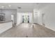 Spacious living room with hardwood floors, and views of the dining and front entrance at 3745 Causey Ct, The Villages, FL 32163