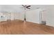 Spacious living room featuring hardwood floors with multiple rooms and doorways at 403 Duarte Ln, The Villages, FL 32159