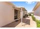 Charming covered patio area with manicured landscaping, perfect for outdoor enjoyment and relaxation at 403 Duarte Ln, The Villages, FL 32159