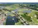 Panoramic aerial view of a golf course community with lakes, fairways, and picturesque landscaping at 503 Vigo St, Davenport, FL 33837