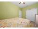 Bedroom with light green walls and neutral-colored flooring at 503 Vigo St, Davenport, FL 33837