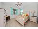 Comfortable bedroom features bright, patterned bedding and a neutral color scheme at 503 Vigo St, Davenport, FL 33837