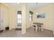 Bright breakfast nook features a charming table set, and tile flooring, perfect for enjoying a sunny morning meal at 503 Vigo St, Davenport, FL 33837