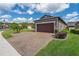 Lovely home with a paver driveway, lush lawn, and well-maintained landscaping at 503 Vigo St, Davenport, FL 33837