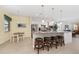 Modern kitchen with white cabinets, granite countertops, stainless steel appliances, and a cozy breakfast bar at 503 Vigo St, Davenport, FL 33837