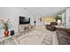 Spacious living room featuring tile flooring, comfortable furniture, and bright natural light at 503 Vigo St, Davenport, FL 33837