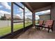 Screened in lanai with a view of the backyard at 503 Vigo St, Davenport, FL 33837