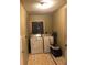 Functional laundry room with a washer, dryer, and storage space at 507 Bates Ave, Eustis, FL 32726