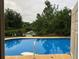 Inviting pool with a serene natural backdrop. Perfect spot for relaxation and recreation at 507 Bates Ave, Eustis, FL 32726