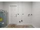 Basement features concrete block walls, concrete floor, water heater and hookups for laundry at 525 Oak Dr, Tavares, FL 32778