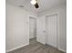 Bedroom features neutral paint, a ceiling fan, wood-look floors and a closet at 525 Oak Dr, Tavares, FL 32778