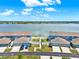 Aerial view of homes near a scenic lake offers stunning views and a tranquil living environment at 534 Juniper Springs Dr, Groveland, FL 34736