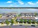 Aerial view of townhomes close to the lake with curbside parking at 534 Juniper Springs Dr, Groveland, FL 34736