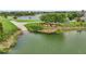 Picturesque view of a boat ramp leading into a lake with lush greenery at 534 Juniper Springs Dr, Groveland, FL 34736