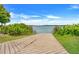 Picturesque boat ramp with lush landscaping leading into a scenic lake at 534 Juniper Springs Dr, Groveland, FL 34736