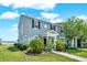 Charming two-story home featuring a well-maintained lawn and tasteful landscaping at 534 Juniper Springs Dr, Groveland, FL 34736