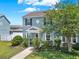 Charming home with a walkway leading to a welcoming front entrance and garden at 534 Juniper Springs Dr, Groveland, FL 34736