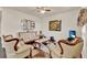 Living room featuring luxurious seating, a patterned rug, and modern decor at 534 Juniper Springs Dr, Groveland, FL 34736
