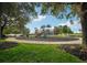 Fun playground with slides and climbing structures, surrounded by trees and green space, ideal for children to play and explore at 534 Juniper Springs Dr, Groveland, FL 34736