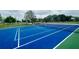 Well-maintained tennis court for residents to enjoy a match, set in a lush green community with a basketball court at 534 Juniper Springs Dr, Groveland, FL 34736