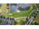 Beautiful aerial view of golf course with lush greenery, water and well-manicured grounds at 537 Montage Ln, Kissimmee, FL 34759