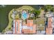 Aerial view of the community center featuring a pool, clubhouse, and lakefront scenery at 537 Montage Ln, Kissimmee, FL 34759