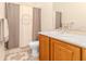 Bathroom with cream colored vanity and light-patterned shower curtain at 537 Montage Ln, Kissimmee, FL 34759