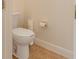 Cozy bathroom with a standard white toilet and tan tiled flooring at 537 Montage Ln, Kissimmee, FL 34759